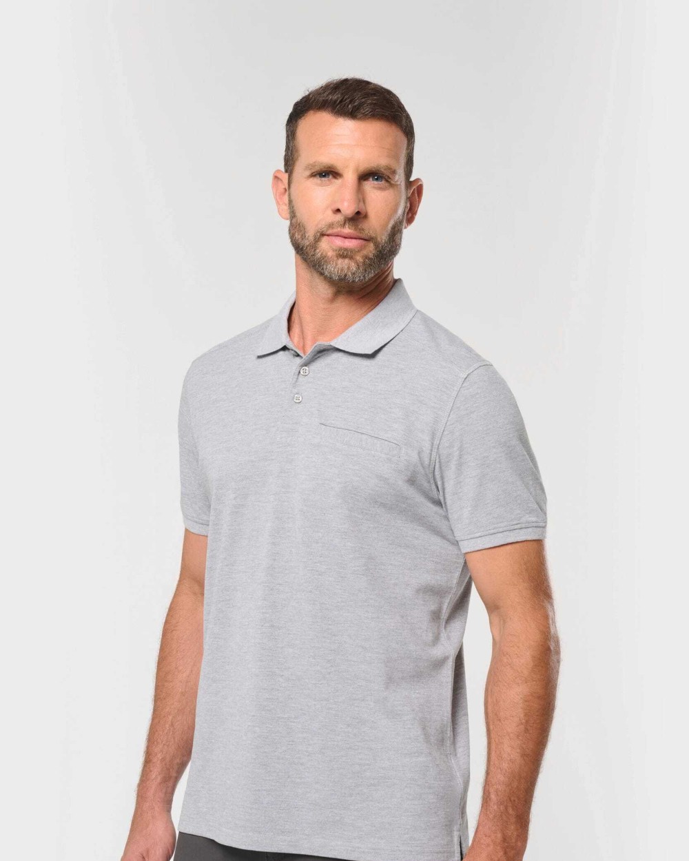 Polos personnalisable WK. DESIGNED TO WORK Polo unisexe écoresponsable avec poche poitrine