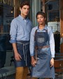 Schorten PREMIER Division - Waxed look denim bib apron with faux leather voor bedrukking &amp; borduring