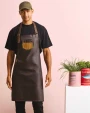 Schorten PREMIER Division - Waxed look denim bib apron with faux leather voor bedrukking &amp; borduring
