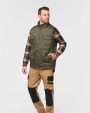 Jassen WK. DESIGNED TO WORK Gewatteerde uniseks bodywarmer van polykatoen multizakken voor bedrukking &amp; borduring