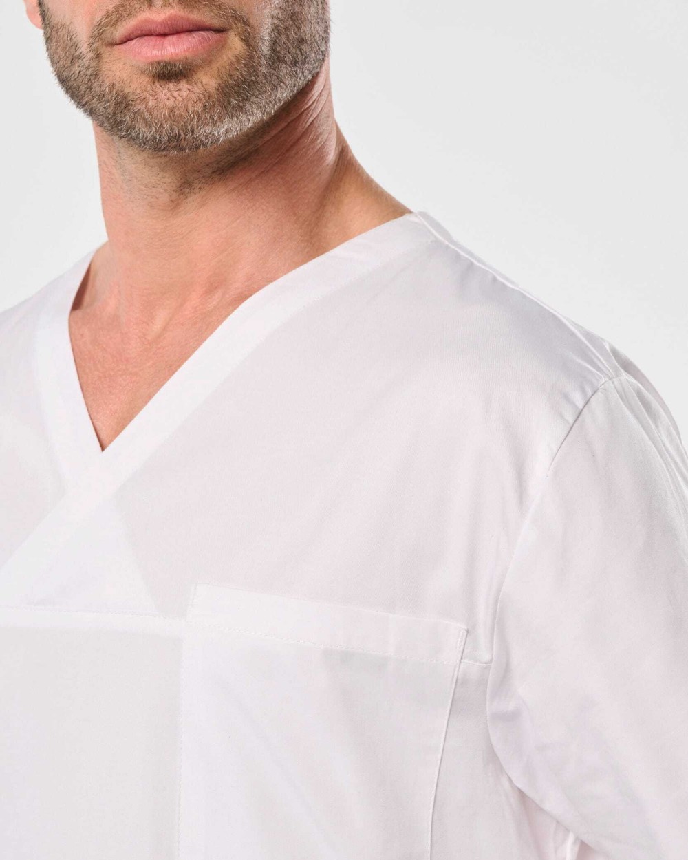 Schorten WK. DESIGNED TO WORK Katoenen unisex tuniek met korte mouwen voor bedrukking &amp; borduring